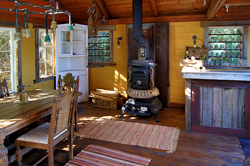 A combined guest cottage - entertainment cottage in a garden of an English Cottage style residence in the town of Martinez, CA.